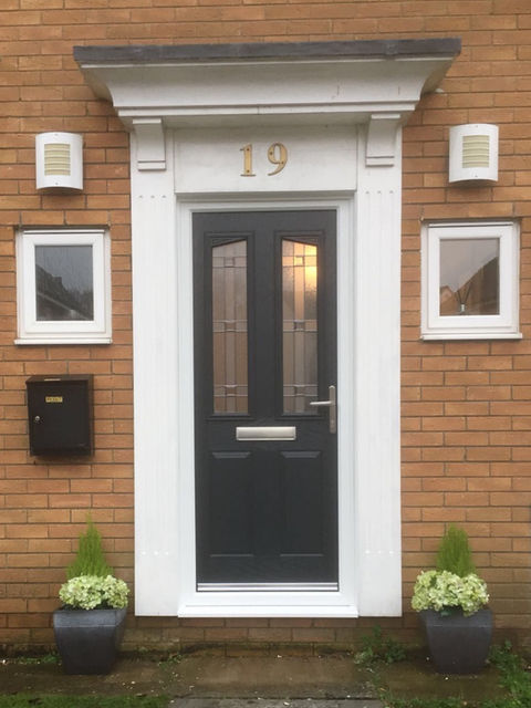 Black composite door with double decorative vertical inserts