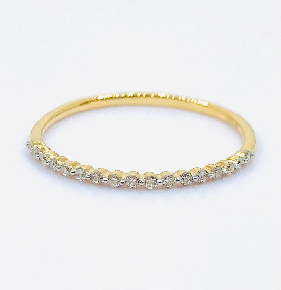 Thumbnail: Sleek Prong Set Round Diamonds in Gold Band