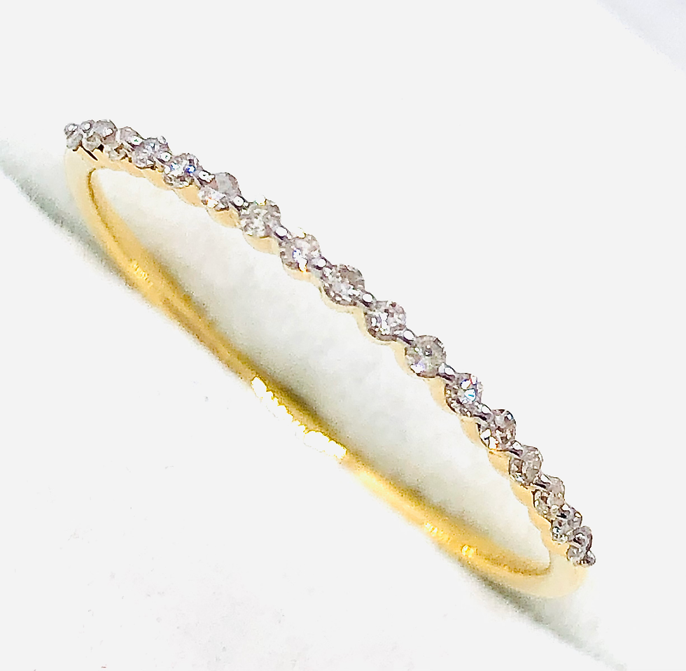 Thumbnail: Sleek Prong Set Round Diamonds in Gold Band