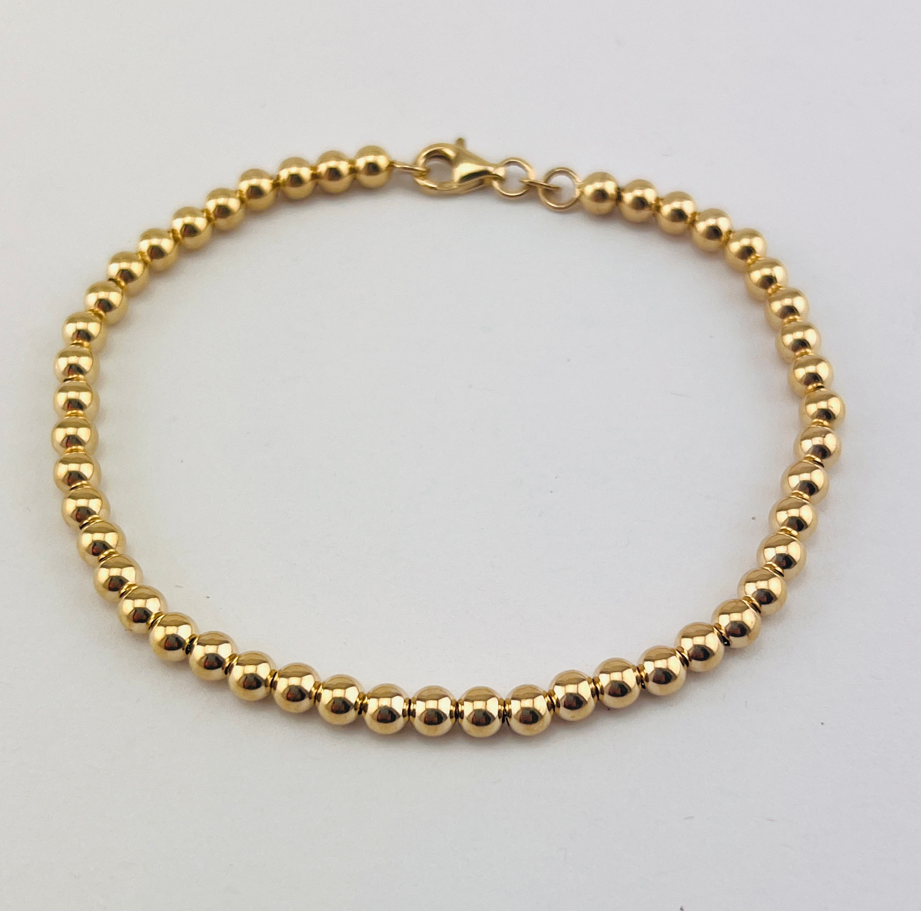 Kugelketten-Armband aus 585er Gelbgold mit polierten Goldkugeln und Karabinerverschluss
