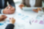 close-up-businesspeople-working-with-documents.jpg