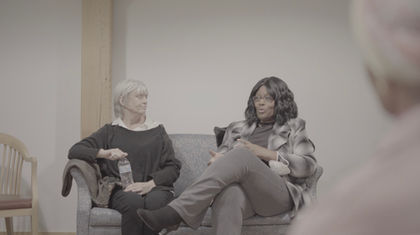Participant sharing her story in a support group