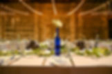 Wedding centerpiece tall blue flowers long table