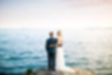 Bride and groom on cliffs overlooking ocean at Misselwood at Endicott Beverly wedding