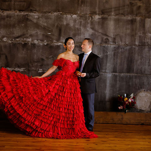 Red dress bride and groom shoot industrial venue