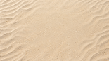 Calm rippled desert sand backdrop.png
