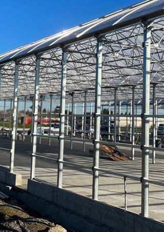 side view of Stuppy greenhouses being built for means nursery