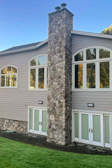 Repaired siding on a two story house in Portland Oregon