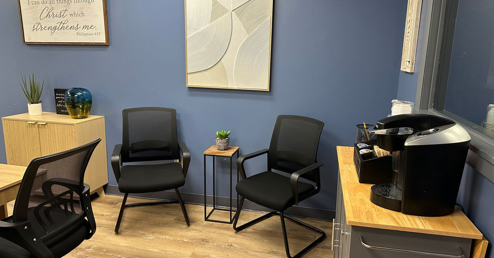 New Birth Christian Ministries and Cancer Ministries conference room with a two-chair sitting area and coffee machine