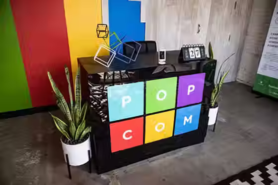 The front reception desk in the Popcom LLC office