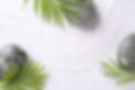 Zen concept. Stones, leaves and pattern on white sand, flat lay.jpg
