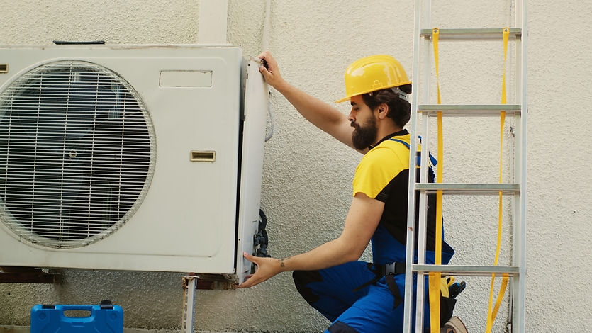 wireman-dissasembling-air-conditioner (FILEminimizer).jpg