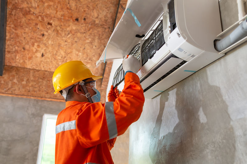 asian-male-technician-wear-safety-clothes-install-air-conditioner-indoors-wear-protective-