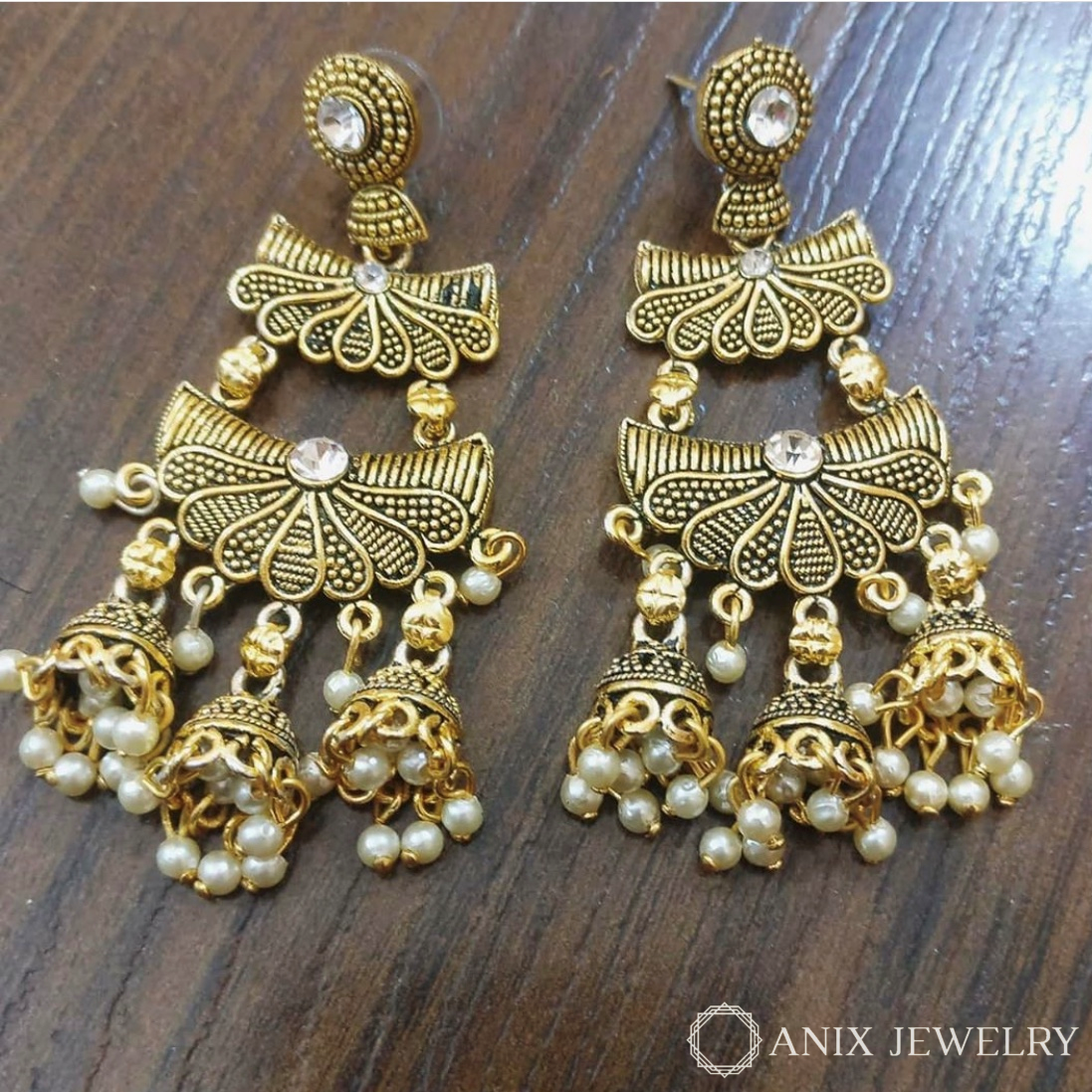 Two layer golden oxidised earrings with 3 Jhumkis