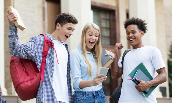 Ecstatic students celebrating outstanding results, a testament to LearnFire's tutoring impact on academic success and achievement.