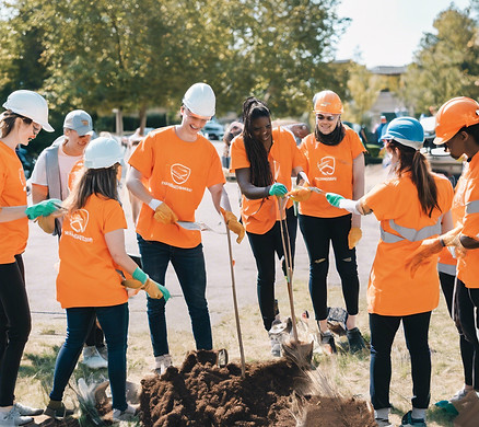 _ A photo of a team volunteering or participating in a community event.
