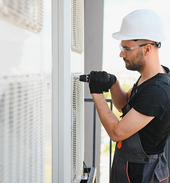 technician-fixing-air-conditioner-on-building-exte-2026-01-08-23-35-13-utc.jpg
