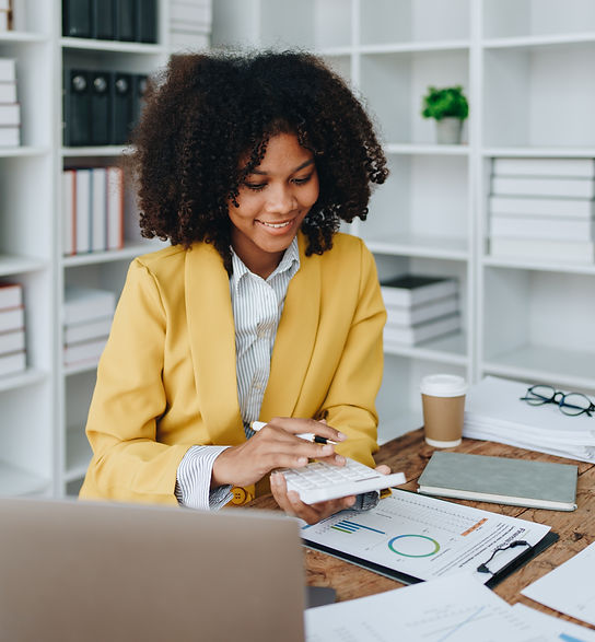 woman-working-with-charts-and-calculator-in-office-2026-03-17-21-29-39-utc.jpg