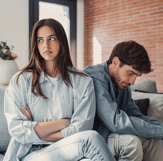 upset-couple-sitting-back-to-back-on-couch-2026-03-19-22-51-42-utc_11zon.jpg