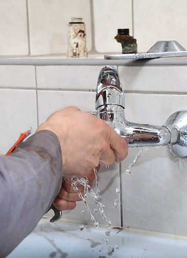 royalty plumbing fixing a plumbing fixture