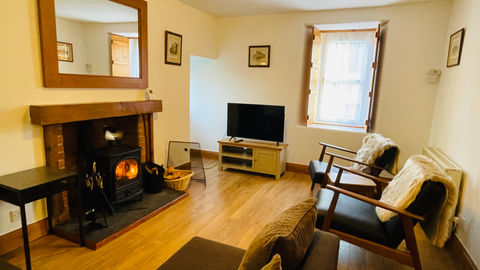 Living room with a logburner, perfect for the highland winter