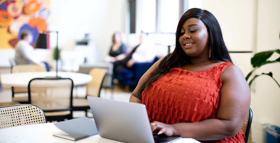 Plus size woman at work in bright, open office workplace_edited.jpg