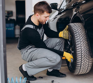 car-mechanic-changing-wheels-car_1303-27471.jpg