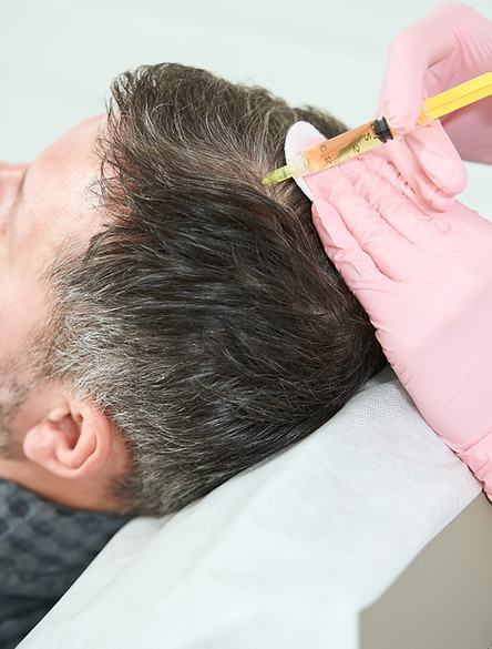 man-receiving-hair-treatment-in-medical-clinic-2026-03-10-04-01-38-utc.jpg