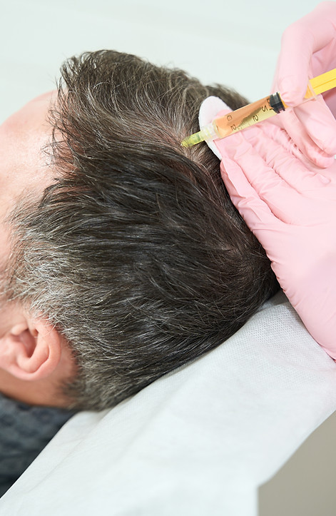 man-receiving-hair-treatment-in-medical-clinic-2026-03-10-04-01-38-utc.jpg