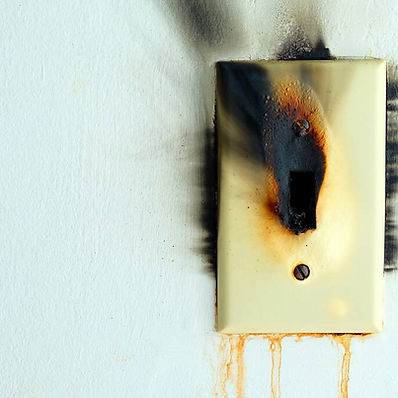 burned-electrical-switch-white-concrete.jpg