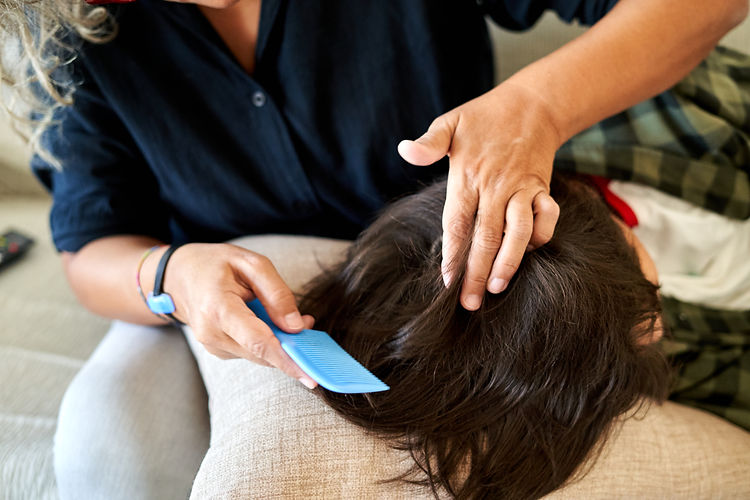 anti-lice-treatment-a-woman-cutting-another-woman-2025-03-05-21-16-46-utc.jpg
