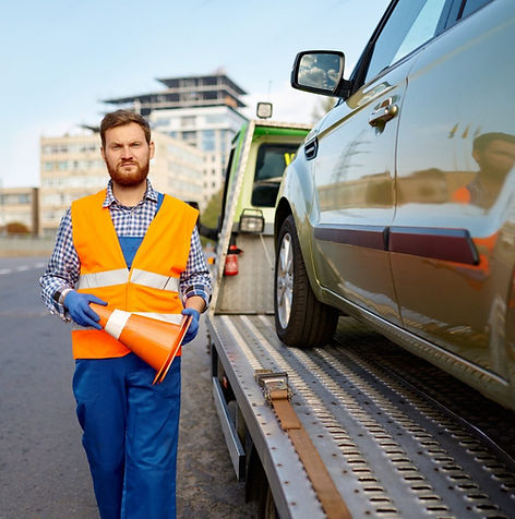 road-worker-putting-traffic-cone-on-roadside-1536x1022.jpg