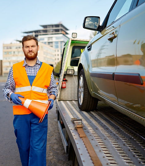 road-worker-putting-traffic-cone-on-roadside-1536x1022.jpg