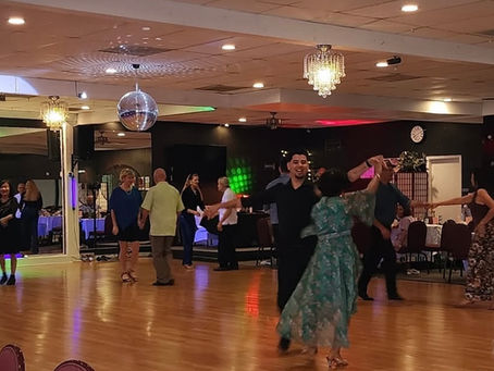 Social dancer performing at an SRQ Dance Instructors event in Florida