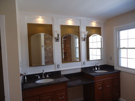 Bathroom Reno after, new lighting, double sink vanity