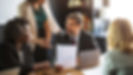 People sitting around a conference table