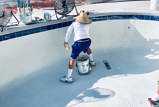 worker-putting-the-finishing-touches-to-the-pool-2026