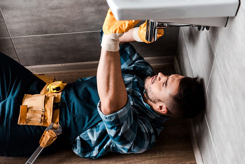 selective-focus-of-repairman-fixing-water-damage-in-bathroom-1536x1025.jpg
