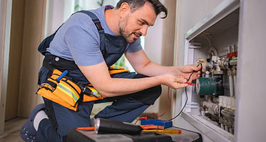 man-repairing-water-heater-with-tools-indoors-2026-03-15-00-43-33-utc_11zon.jpg