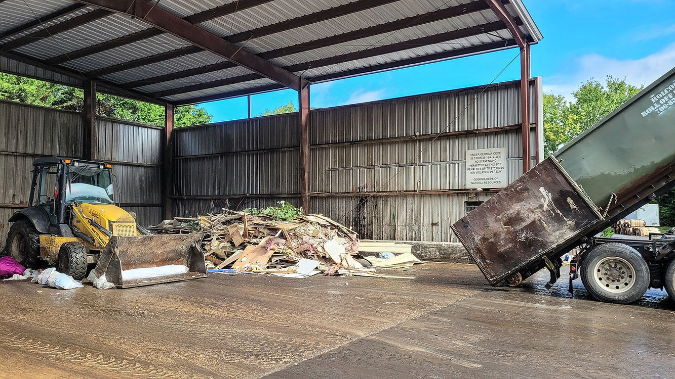 dump-truck-has-dumped-trash-in-shed-and-bulldozer-2026-01-09-00-03-28-utc.jpg