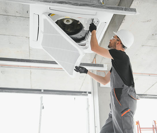 worker-repairing-ceiling-air-conditioning-unit-2026-01-09-11-56-39-utc.jpg