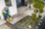 men-pressure-washing-house-surrounding-concrete-el-2023-11-27-05-27-54-utc-scaled.jpeg
