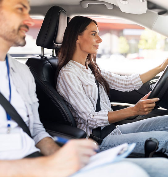 confident-young-lady-passing-exams-at-driving-scho-2026-03-24-02-24-25-utc.jpg