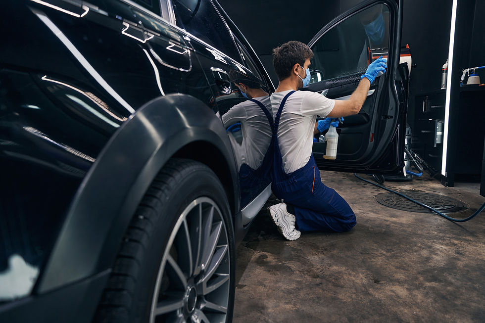 man-in-repair-workshop-washing-car-window-during-c-2026-01-08-06-56-55-utc.jpg