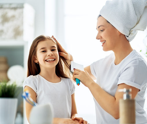 mother-and-daughter-combing-hair-2024-11-05-10-01-20-utc.jpg