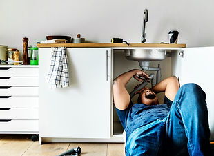 plumber-man-fixing-kitchen-sink.jpg
