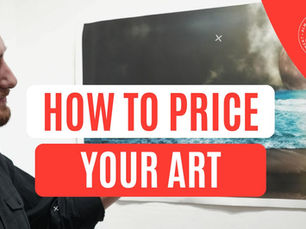 Smiling artist standing beside a seascape painting with bold text overlay that reads ‘How to Price Your Art’ for an article about pricing artwork.