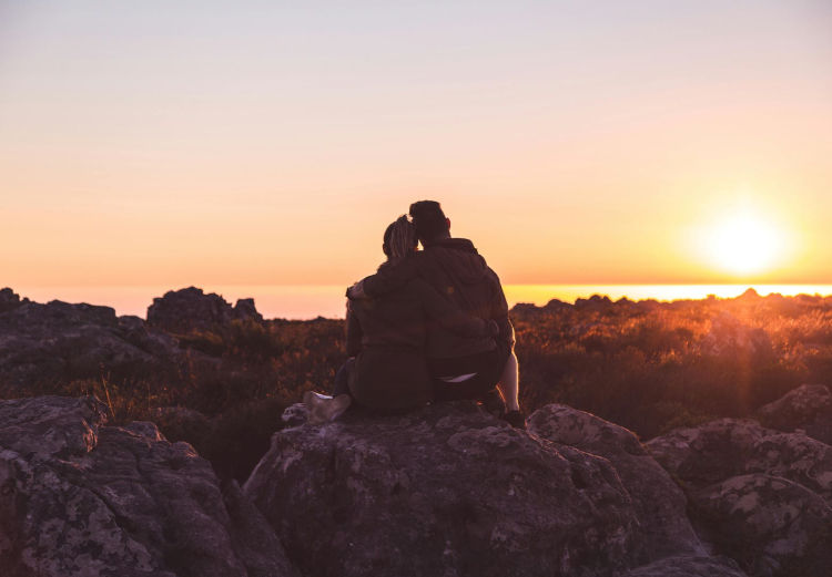image of a couple looking at sunset