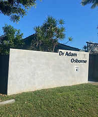 Before photo of commercial retainer wall pressure washing job by Edge Pressure Cleaning for local business in Ballina NSW