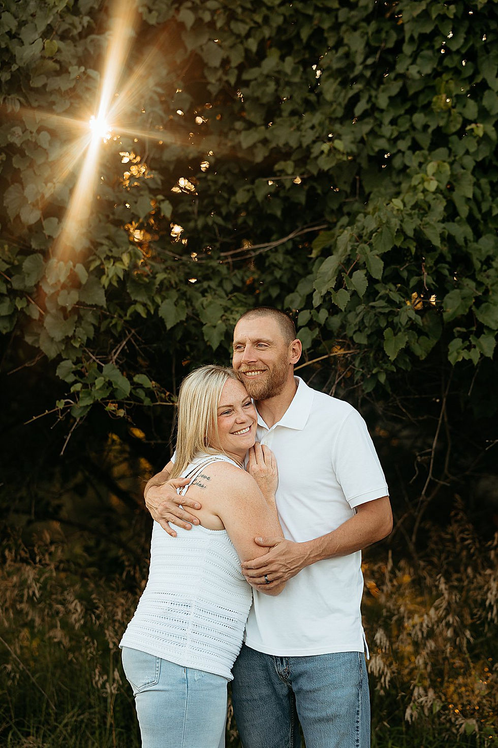 Parents together during a summer family photo session at Peace Valley Park